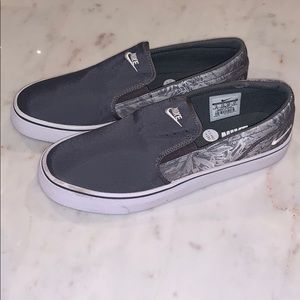 Nike grey and white slip on Toki sneakers